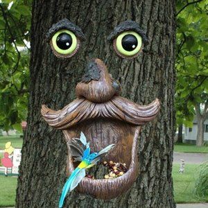 Birdfeeder with Old Man's Eyes Glowing in Dark Tree Hugger Sculpture